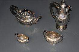 A Victorian silver four piece teaset, comprising teapot, hotwater pot, sugar and cream, of rounded