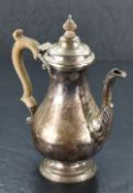 A Queen Elizabeth II silver coffee pot, of baluster form with domed and hinged finial topped cover