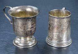 An Edwardian silver cup, with foliate swag engraving and inscription, on a stepped circular base,