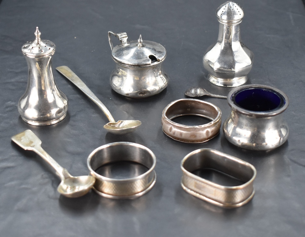 A selection of miscellaneous silver items, to include condiments, napkin rings and spoons, various