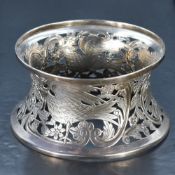 An early 20th century Irish silver dish ring, of waisted circular form, pierced and engraved with