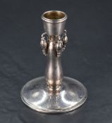 A Georg Jensen (Denmark) sterling silver 'Blossom' pattern candlestick, the slightly tapering socket