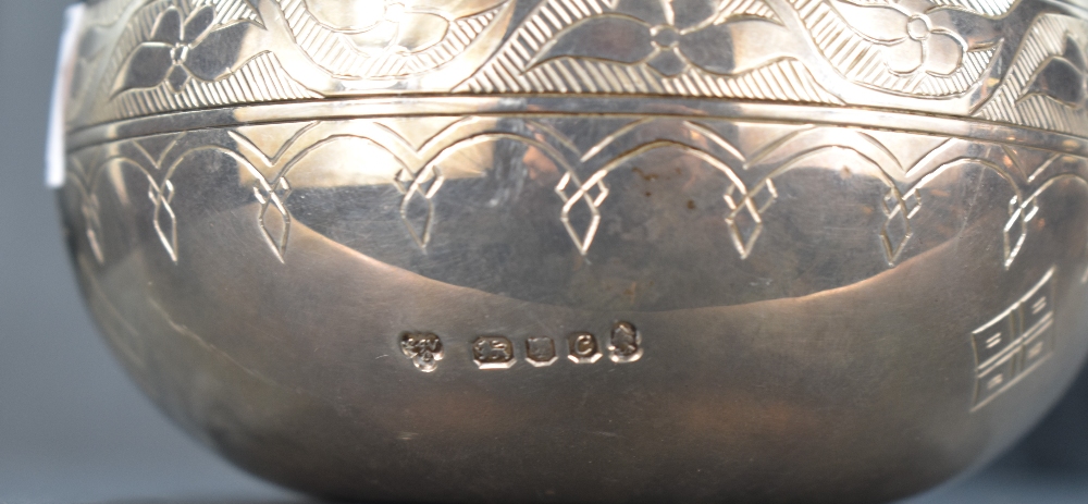 An unusual Elizabeth II silver vessel of globular form with substantial angled spout, decorated with - Image 2 of 2