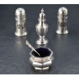 A pair of George V silver pepperettes, of cylindrical form with central pierced band and pierced