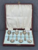 A cased set of six George V silver coffee spoons, reed and ribbon pattern with bell flower pendants,