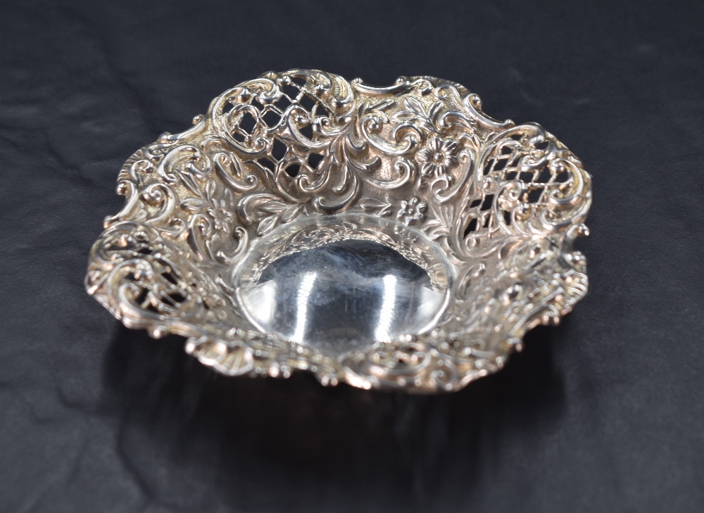 An Edwardian silver dish, of shaped pierced and embossed circular form, marks for Birmingham 1907,
