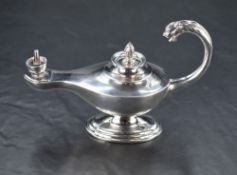 A George V silver 'Genie Lamp' table cigar lighter, marked for Birmingham 1932, maker P J Finch Ltd,
