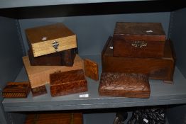 A good selection of wooden storage boxes including burr wood smokers cases and an Art Deco jewellery