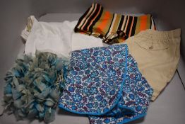 A mixed lot of items including shorts, 1960s hat, swimming trunks and 1940s apron.