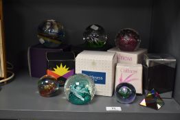 A fine selection of modern art glass paper weights including five boxed Caithness paper weights