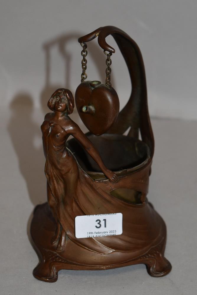 An Art Nouveau container, in coppered patinated pewter with a female figure draped around a