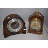 An early 20th century Smiths mantel clock and a similar bracket style clock by Elliott
