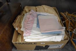 A small lot of vintage bedding, including Art Deco Eiderdown in pale pink satin and sheets and