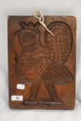 An antique wooden artisan made double sided biscuit or pastry mold having image of a cockerel and on