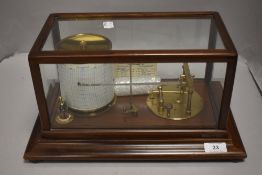 An early 20th century Short and Mason barograph having a fitted mahogany and glass case.