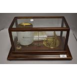 An early 20th century Short and Mason barograph having a fitted mahogany and glass case.