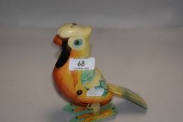 A mid century tin plate toy parrot no makers marks or key.