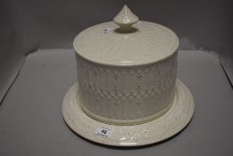 A Victorian cheese dome with embossed lattice work decoration.