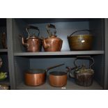 A selection of vintage kitchen stove items including three copper kettles, a jam pan and two