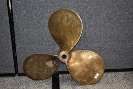 A large brass ships propeller marked 24 x 18 LH