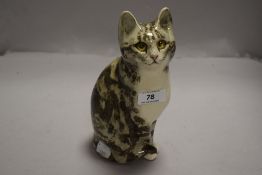 A Winstanley figure of a tabby cat, signed L,Winstanley 2, 22cm tall.