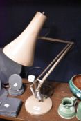 A vintage Anglepoise style adjustable lamp in brown.