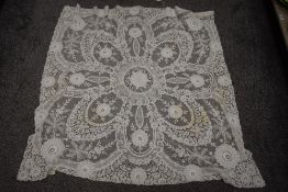 A vintage tulle and lace shawl or cloth having beautiful details throughout.