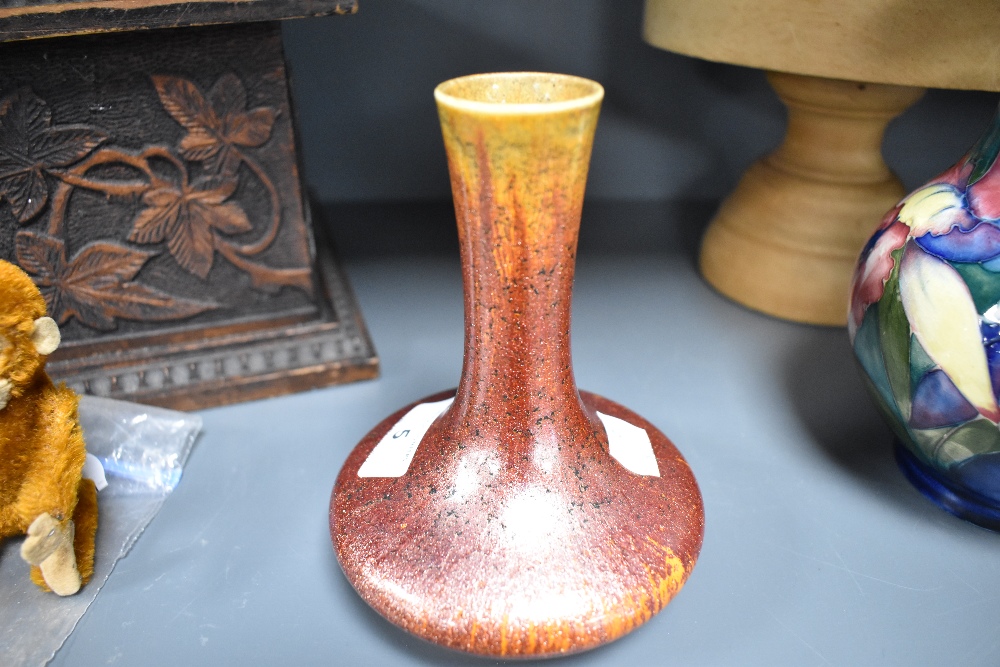 An early 20th century Pilkingtons Royal Lancastrian pottery vase of squat fluted trumpet form having