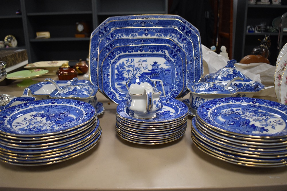 A fine selection of Burleigh ware in the Willow pattern, including serving dishes, dinner plates and