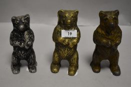 Three early 20th century penny saving money banks in the form of bears.
