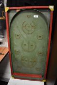 A vintage childrens toy bagatelle game board