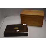 A mahogany cased smokers humidor with a similar golden oak lidded storage box