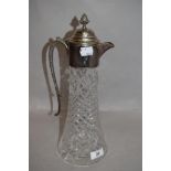 A 20th century clear cut crystal claret jug having silver plated lid and naturalistic ivy vine