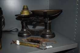 A set of kitchen weighing scales with weight set and three spring balance scales,