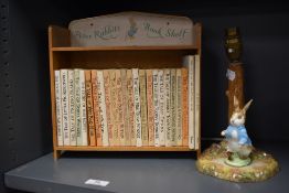 An early 20th century Beatrix Pottery story book set and Peter Rabbits Book shelf, most volumes
