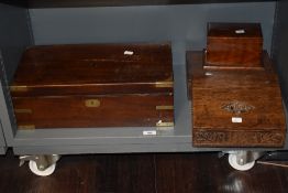 Two well carved Victorian oak carved cases one as a writing set carved with Desk and dated 1885 with