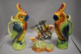 A pair of St Clement's Barbotta parrot design water jugs both in excellent condition with a