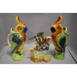 A pair of St Clement's Barbotta parrot design water jugs both in excellent condition with a