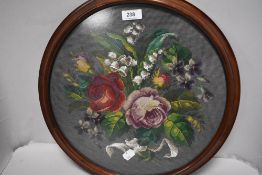 A modern embroidered floral circular picture.