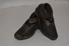 A pair of antique childrens Lancashire clogs in the traditional design, small size 14cm long.