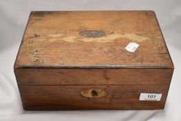 A small vintage jewellery case containing a small selection of costume jewellery including bracelet,