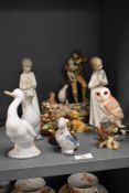 A selection of modern figures and figurines including Nao ducks, Beswick Barn Owl and Wade terrier