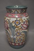 An early 20th century Charlotte Rhead Bursley ware vase decorated with tube lined flowers in a