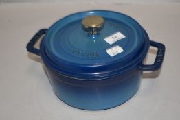 A modern La Cocotte Staub casserole dish in blue enamel.