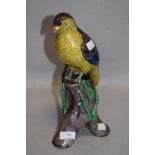 A Meiji period Japanese export porcelain parrot figure perched on naturalistic branch and fungus.