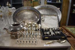 A cased condiment and salts set, a HM silver port label, two monogrammed serving dishes and a muffin