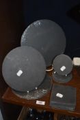 A selection of modern cut slate table and place mats