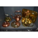 A selection of copper and brass wares including serving tray, jam pan, stove kettle and foot