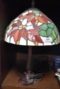 A modern Tiffany style lamp with a leaded light shade