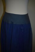 A Victorian royal blue skirt or petticoat having tie fastening to waist.